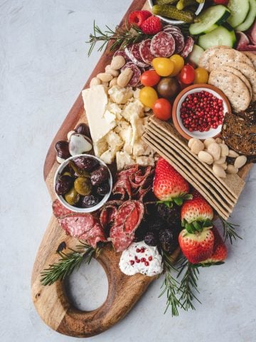 charcuterie board, cheese board, cheese, salami, appetizer, snack