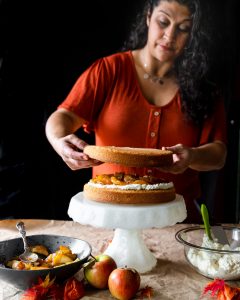Woman assembling layer cake