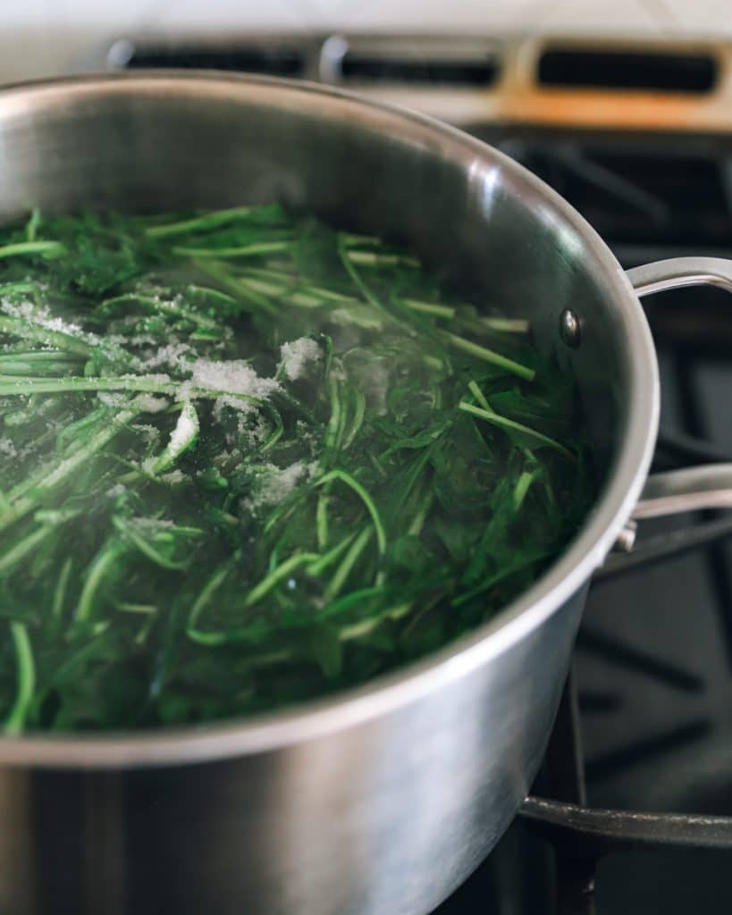Trimming and boiling dandelion greens