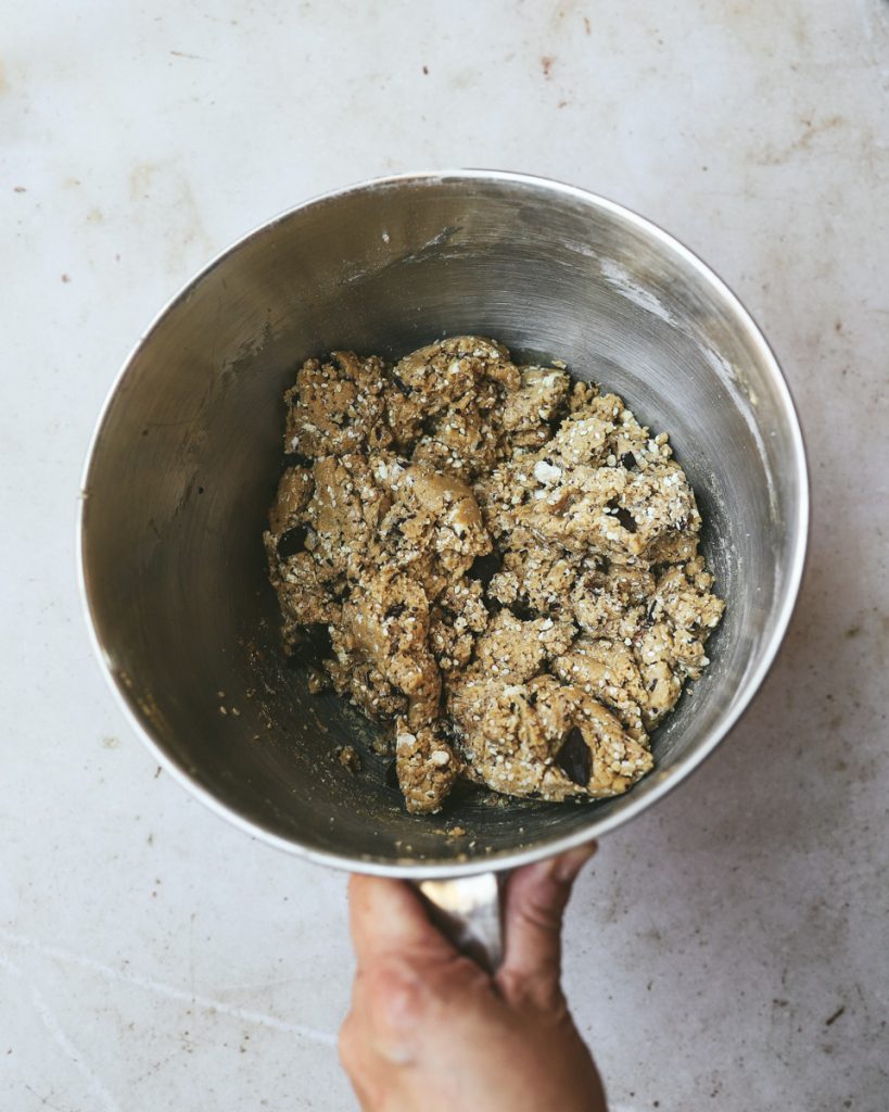 Mixing dry ingredients to tahini cookies