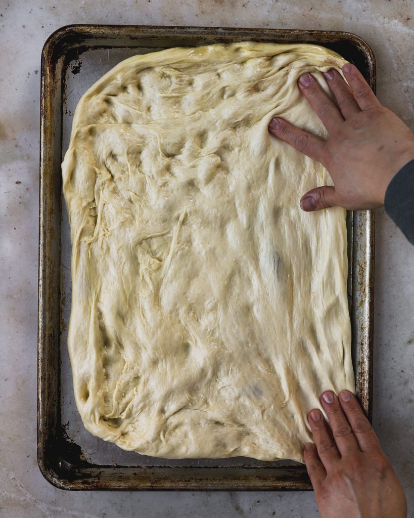 Dough stretched on sheet pan