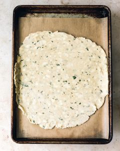 caramelized_onion_tart_process_pie-dough-on-parchment-lined-sheet-pan