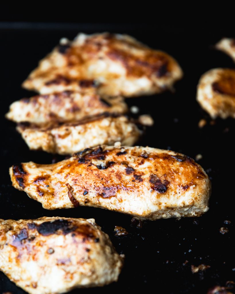 grilled chicken on the grill, char marks on chicken