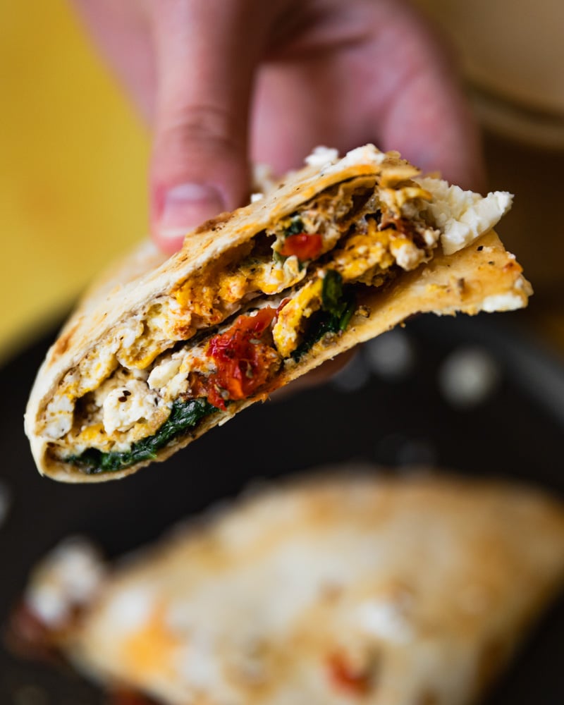 egg taco on plate cut in half