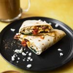 egg taco on plate cut in half