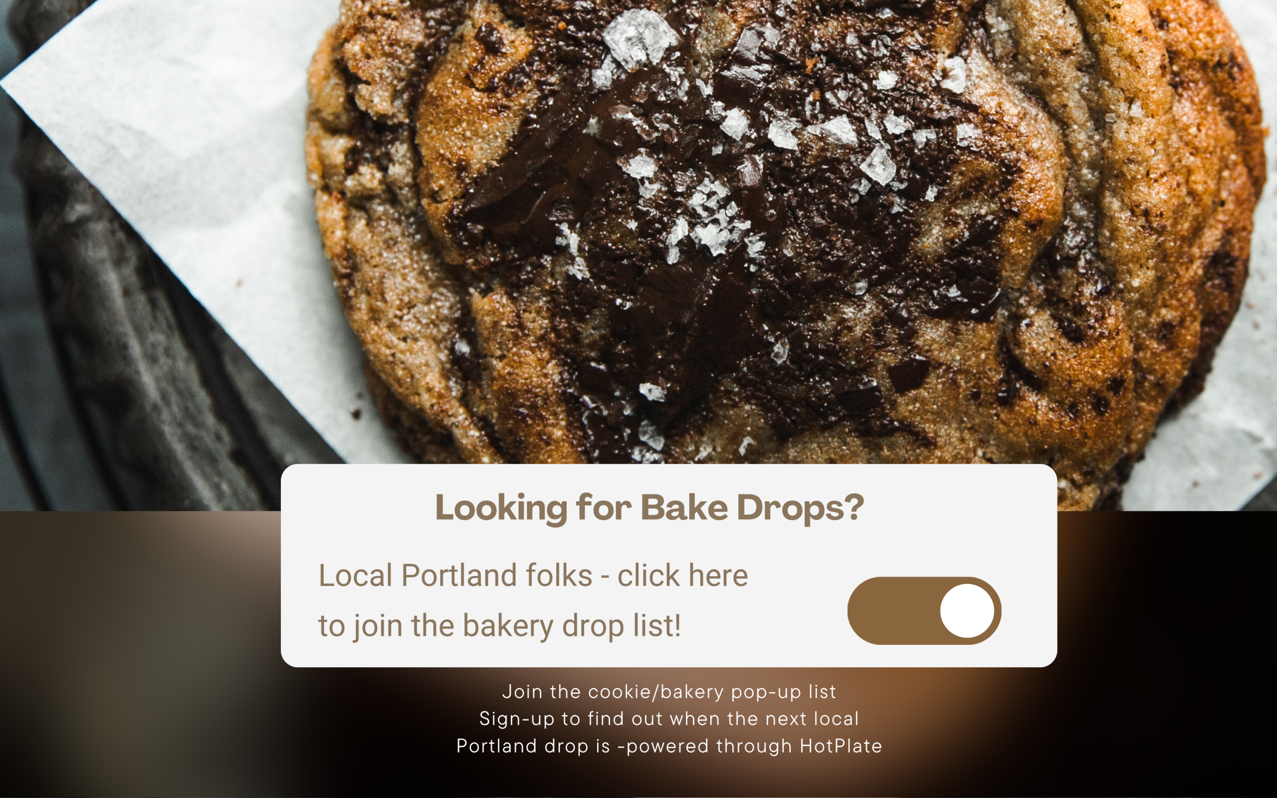 photo with large chocolate chunk cookie and text for Cookie bakery drop information